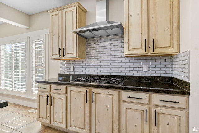 kitchen featuring ventilation hood, light brown cabinets, and stainless steel gas stovetop