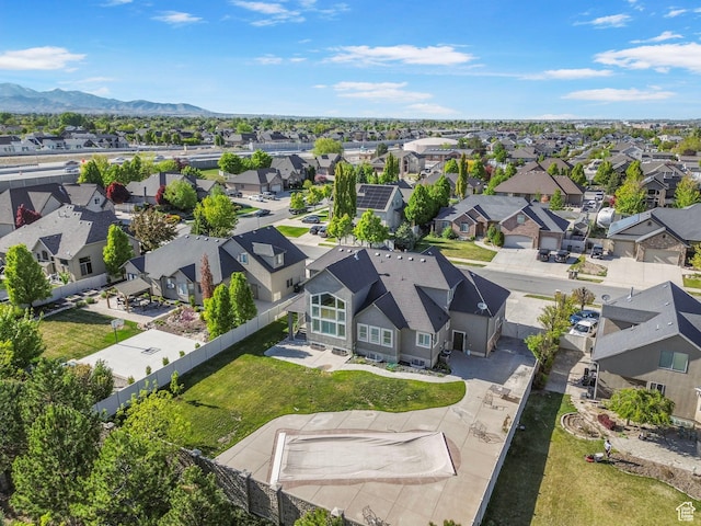 drone / aerial view featuring a mountain view and a residential view