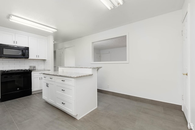 5550 Westside Dr, Kearns, UT 84118 - kitchen with decorative backsplash, light stone countertops, baseboards, black appliances, and white cabinetry