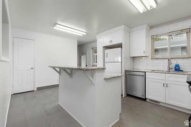 5550 Westside Dr, Kearns, UT 84118 - kitchen with a sink, dishwasher, a center island, white cabinetry, and visible vents
