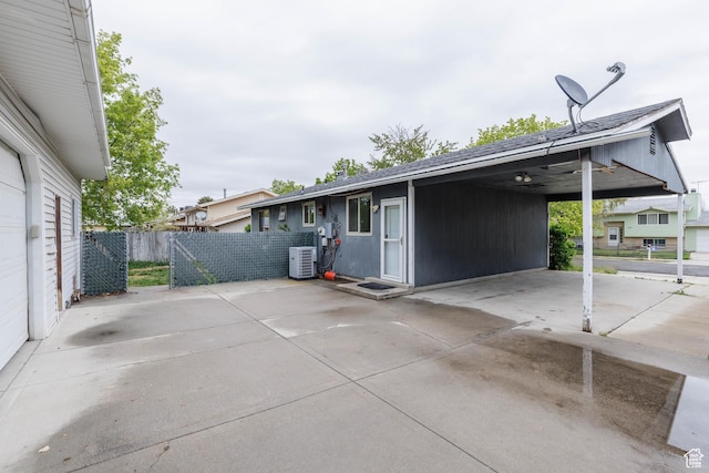 5550 Westside Dr, Kearns, UT 84118 - view of home's exterior featuring a patio area, fence, an attached carport, and concrete driveway