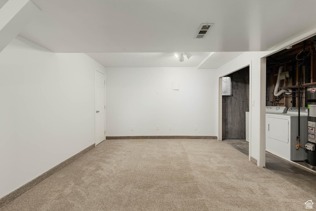 5550 Westside Dr, Kearns, UT 84118 - finished below grade area featuring carpet floors, separate washer and dryer, baseboards, and visible vents