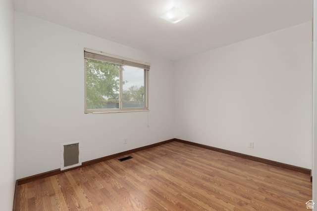 5550 Westside Dr, Kearns, UT 84118 - spare room with baseboards, visible vents, and light wood-style floors
