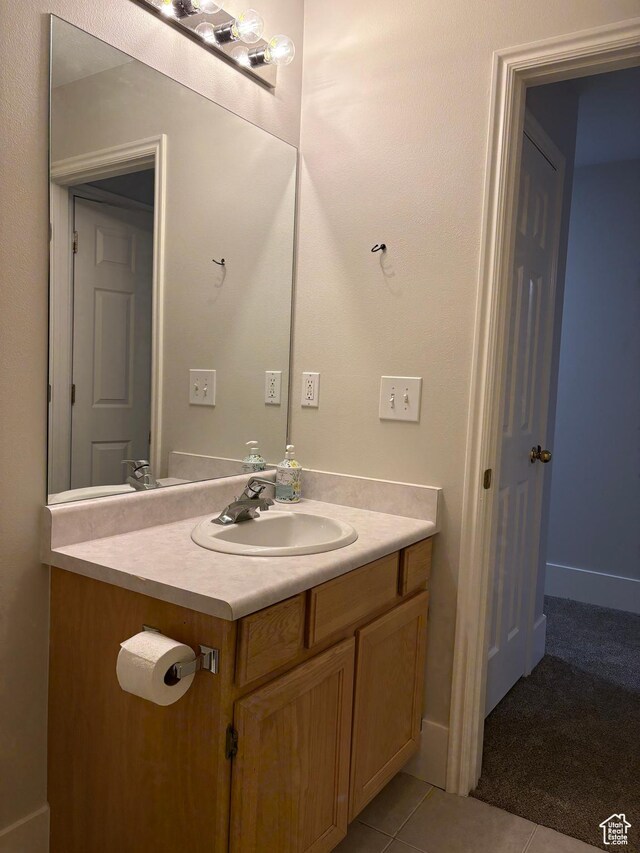 bathroom featuring tile patterned floors and vanity
