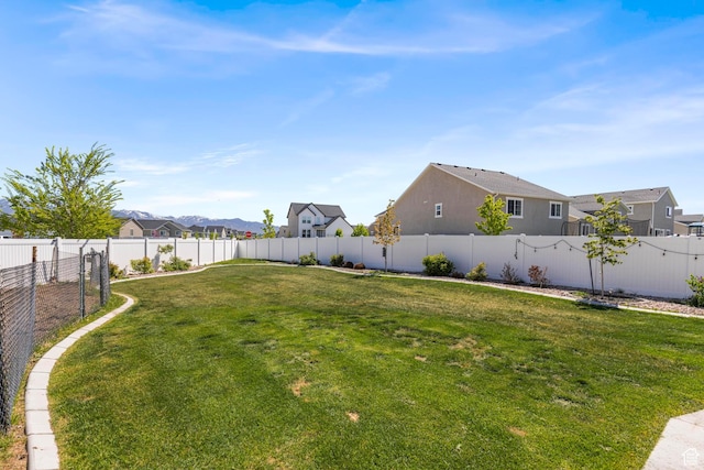 5829 N Goldfinch Ln, Stansbury Park, UT 84074 - view of yard with a fenced backyard and a residential view