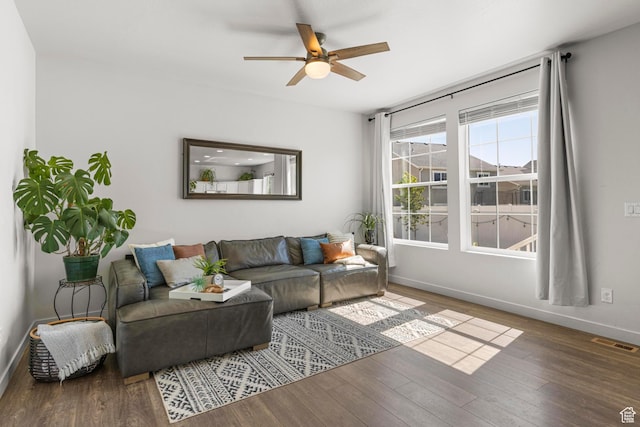5829 N Goldfinch Ln, Stansbury Park, UT 84074 - living room with a ceiling fan, baseboards, visible vents, and wood finished floors