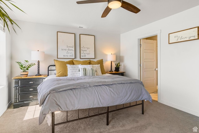 5829 N Goldfinch Ln, Stansbury Park, UT 84074 - carpeted bedroom with baseboards, visible vents, and ceiling fan