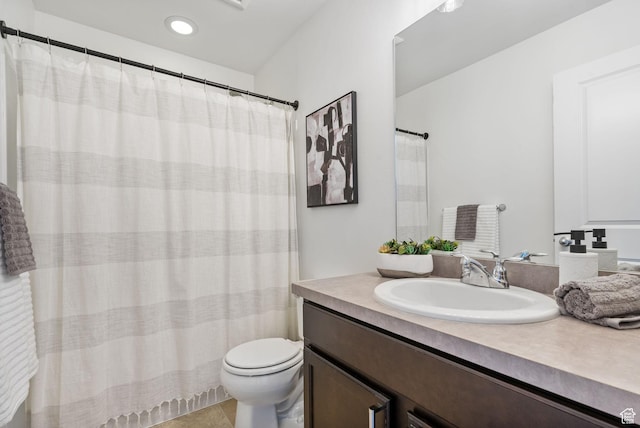 bathroom featuring toilet and vanity