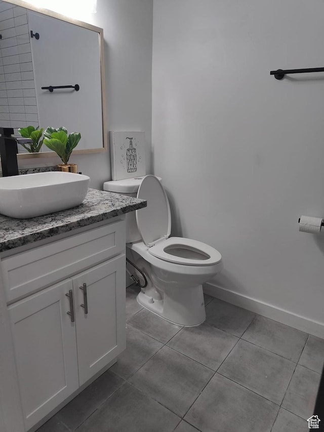 3112 S 3780 W, West Valley City, UT 84120 - half bathroom with tile patterned flooring, vanity, toilet, and baseboards
