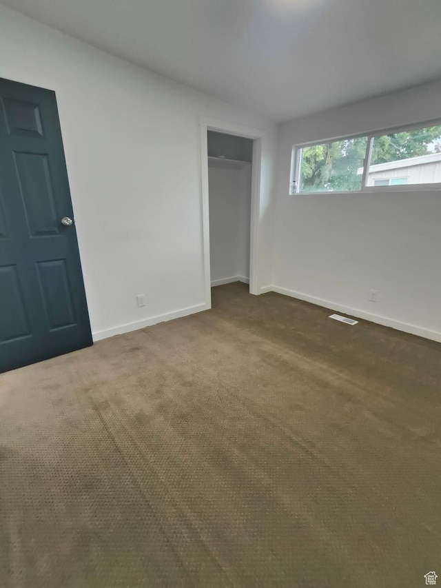 3112 S 3780 W, West Valley City, UT 84120 - unfurnished bedroom with dark carpet, baseboards, and a closet