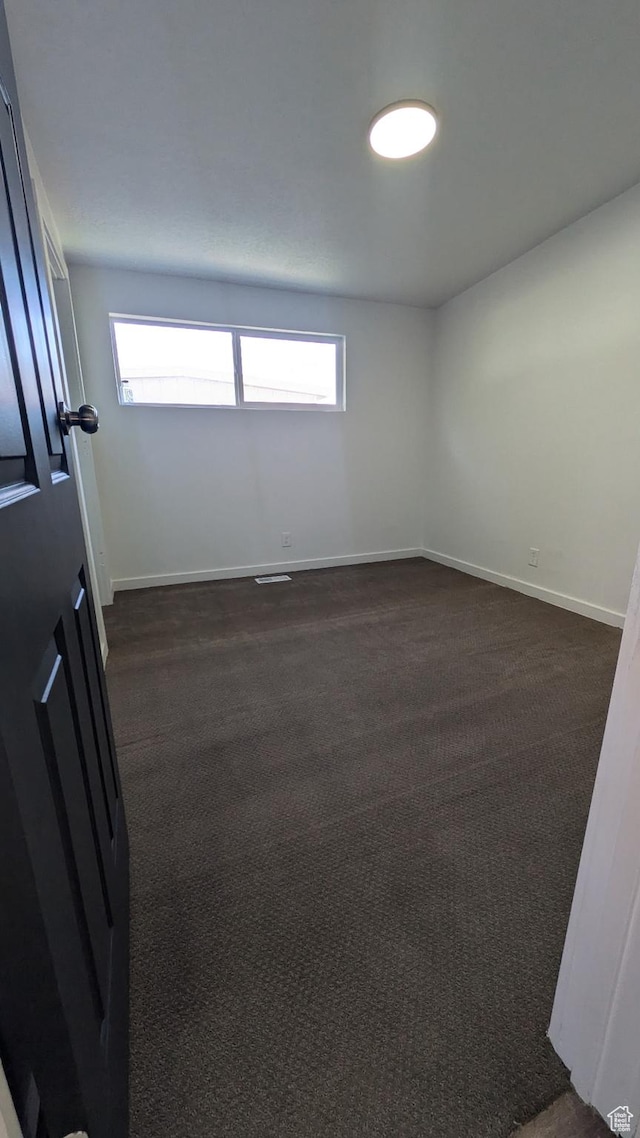 3112 S 3780 W, West Valley City, UT 84120 - unfurnished room with plenty of natural light, baseboards, and dark colored carpet