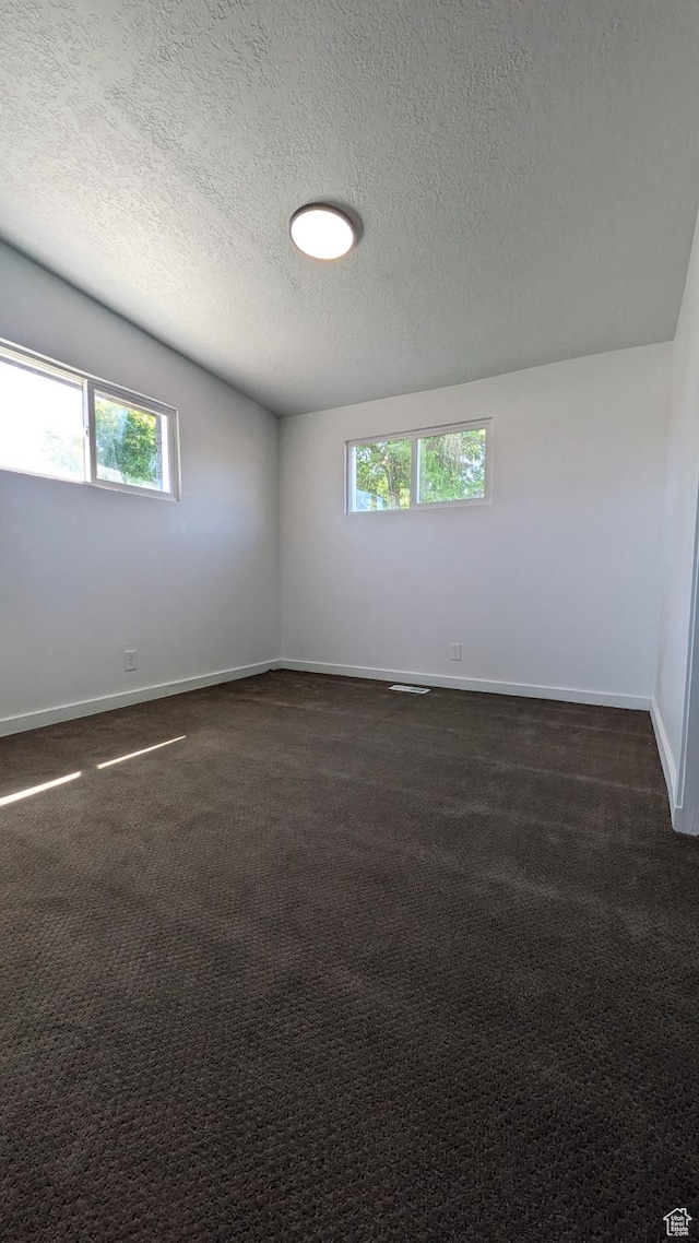 3112 S 3780 W, West Valley City, UT 84120 - spare room with a textured ceiling, baseboards, and dark colored carpet