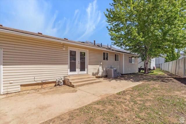 5782 Redwood Ln, South Ogden, UT 84403 - back of property featuring french doors, fence, cooling unit, a patio, and entry steps