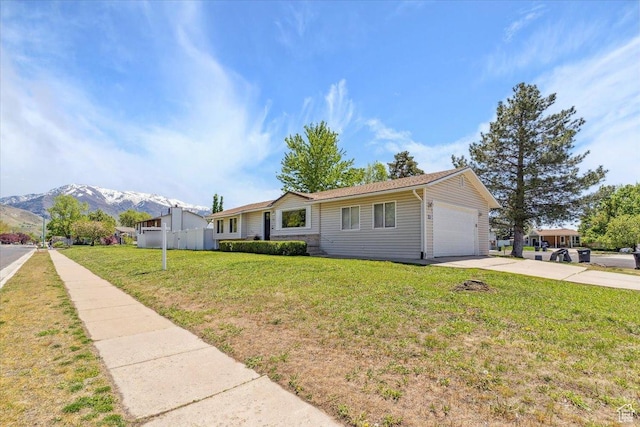 5782 Redwood Ln, South Ogden, UT 84403 - single story home with driveway, a garage, fence, a mountain view, and a front lawn