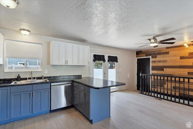 5782 Redwood Ln, South Ogden, UT 84403 - kitchen featuring stainless steel dishwasher, a sink, a peninsula, and dark countertops
