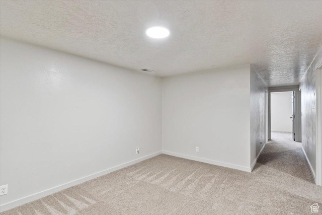 5782 Redwood Ln, South Ogden, UT 84403 - unfurnished room with visible vents, a textured ceiling, carpet, and baseboards