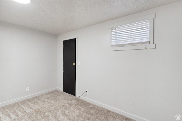 5782 Redwood Ln, South Ogden, UT 84403 - spare room with baseboards, carpet, and a textured ceiling