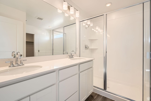 2185 W 1960th St N, Lehi, UT 84043 - full bath with a stall shower, double vanity, recessed lighting, a walk in closet, and wood finished floors
