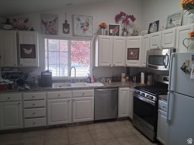 2434 W 2250 N, Clinton, UT 84015 - kitchen with a sink, light tile patterned floors, white cabinets, and stainless steel appliances