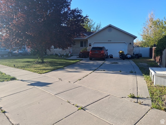 2434 W 2250 N, Clinton, UT 84015 - ranch-style home with an attached garage, fence, driveway, and a front lawn