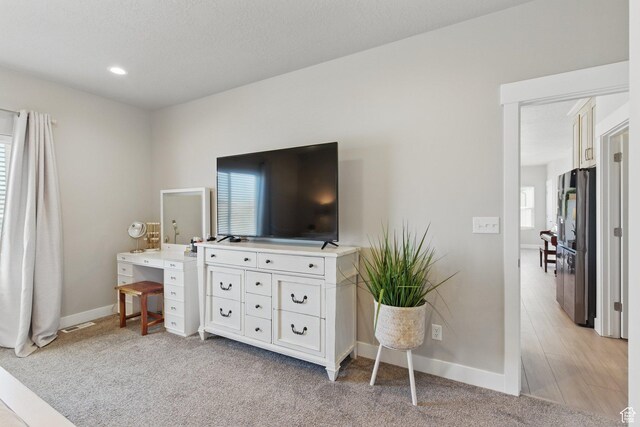1147 N Carriage Ln, Spanish Fork, UT 84660 - bedroom featuring baseboards, multiple windows, and freestanding refrigerator