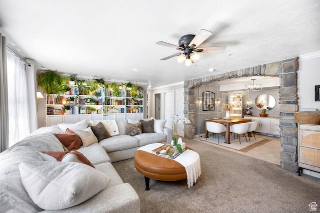 929 W 670 S Unit 8, Pleasant Grove, UT 84062 - carpeted living room featuring crown molding and ceiling fan with notable chandelier