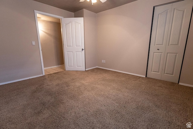 4902 W Pine Laurel Ln, West Jordan, UT 84081 - unfurnished bedroom featuring carpet flooring, a ceiling fan, and baseboards