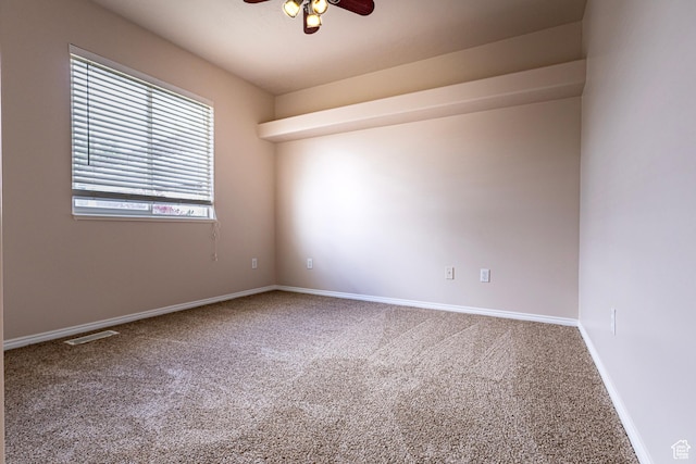 4902 W Pine Laurel Ln, West Jordan, UT 84081 - spare room featuring carpet floors, baseboards, and a ceiling fan