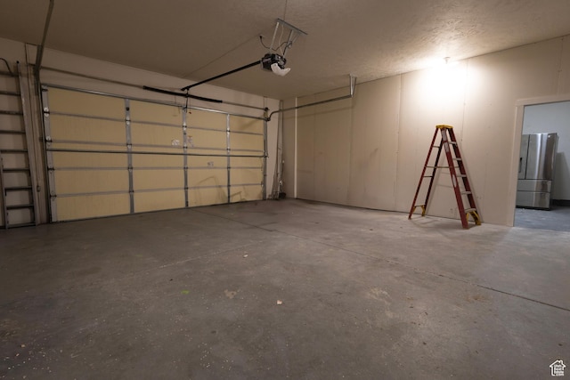 4902 W Pine Laurel Ln, West Jordan, UT 84081 - garage featuring a garage door opener and freestanding refrigerator