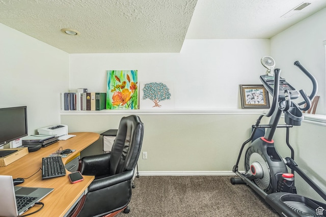carpeted office with baseboards, a textured ceiling, and visible vents
