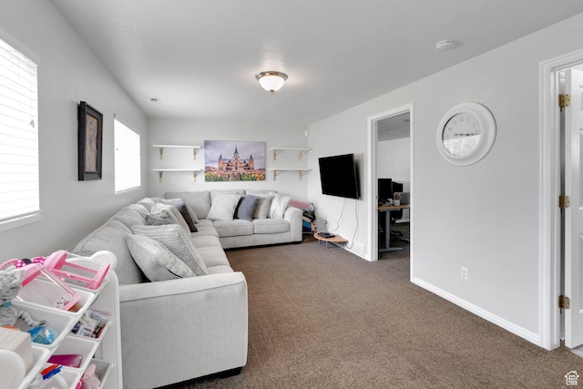 carpeted living room with baseboards