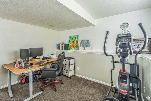 office area featuring carpet floors, baseboards, and a textured ceiling