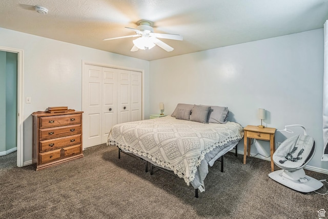 bedroom featuring a closet, a ceiling fan, baseboards, and dark carpet