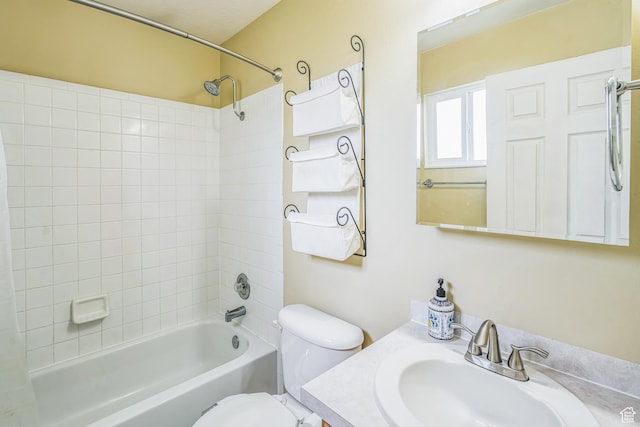 bathroom featuring vanity, shower / bathtub combination with curtain, and toilet