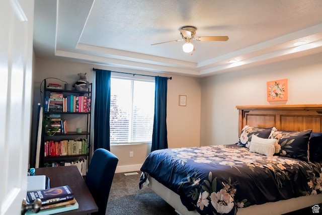 4866 W Spirit Lake Cir, Riverton, UT 84096 - bedroom with baseboards, ceiling fan, carpet, and a tray ceiling