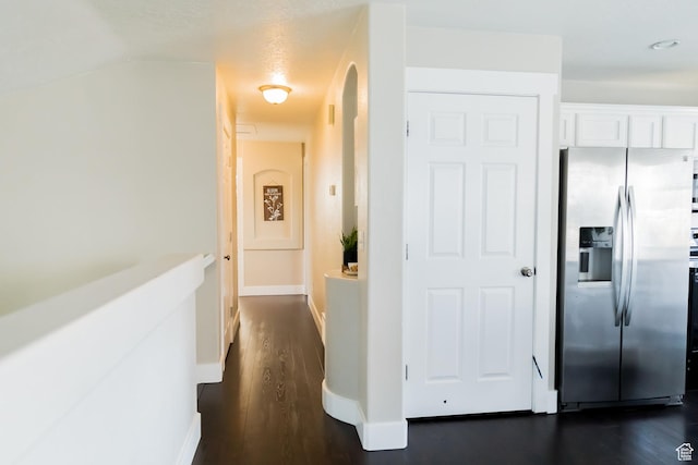 4866 W Spirit Lake Cir, Riverton, UT 84096 - hallway featuring dark wood-style flooring and baseboards