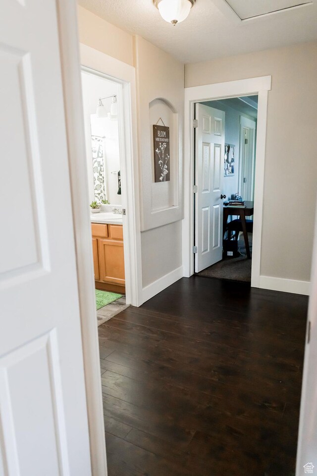 4866 W Spirit Lake Cir, Riverton, UT 84096 - hall featuring baseboards and dark wood-style floors