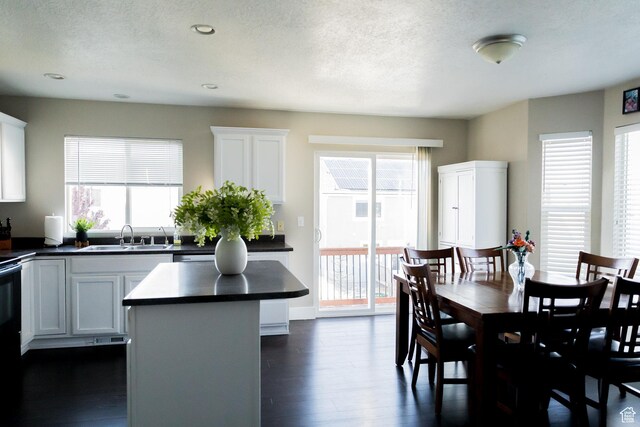 4866 W Spirit Lake Cir, Riverton, UT 84096 - dining area with recessed lighting, a textured ceiling, and dark wood finished floors