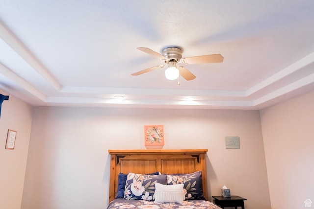 4866 W Spirit Lake Cir, Riverton, UT 84096 - bedroom featuring a ceiling fan and a tray ceiling