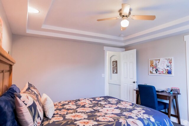 4866 W Spirit Lake Cir, Riverton, UT 84096 - bedroom featuring a raised ceiling and ceiling fan
