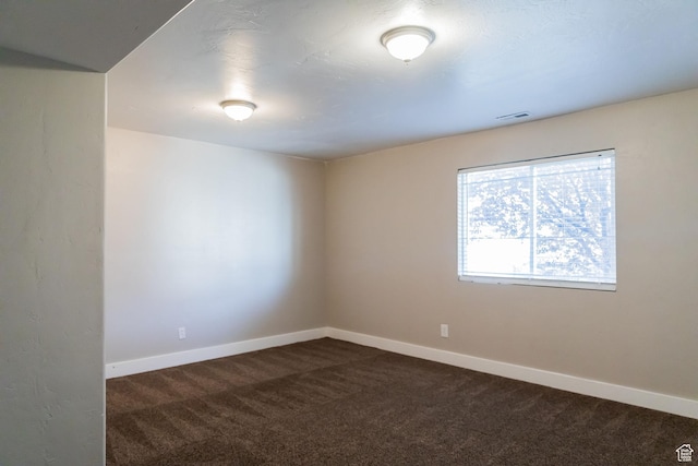 4866 W Spirit Lake Cir, Riverton, UT 84096 - empty room with baseboards, visible vents, and dark carpet