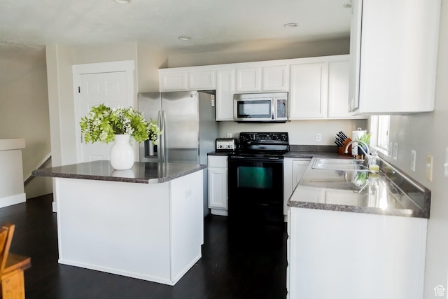 4866 W Spirit Lake Cir, Riverton, UT 84096 - kitchen with appliances with stainless steel finishes, a sink, recessed lighting, white cabinetry, and dark wood-type flooring