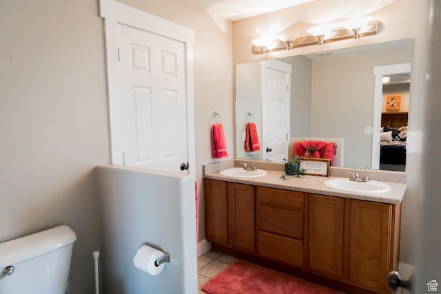 4866 W Spirit Lake Cir, Riverton, UT 84096 - full bath featuring double vanity, toilet, a sink, and tile patterned flooring
