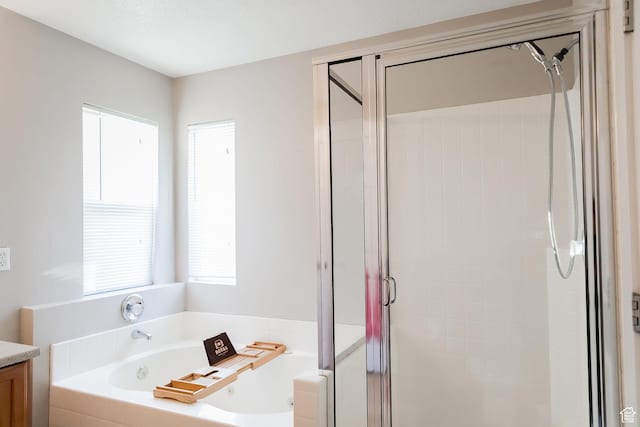 4866 W Spirit Lake Cir, Riverton, UT 84096 - full bathroom featuring vanity, a stall shower, and a bath