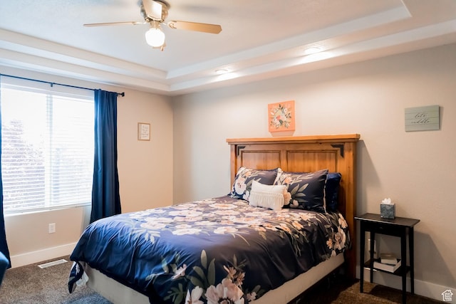 4866 W Spirit Lake Cir, Riverton, UT 84096 - bedroom with a ceiling fan, visible vents, baseboards, carpet, and a tray ceiling