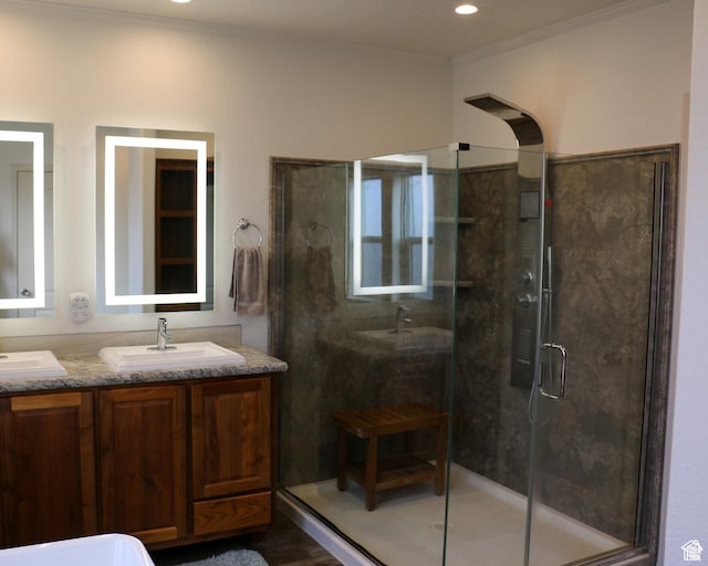 610 S Trout Dr, Manila, UT 84046 - full bathroom with crown molding, double vanity, recessed lighting, a sink, and a stall shower