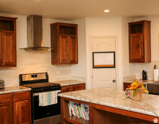 610 S Trout Dr, Manila, UT 84046 - kitchen featuring wall chimney range hood, open shelves, light stone counters, stainless steel range with gas stovetop, and decorative backsplash