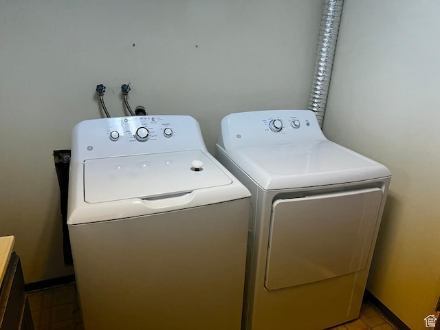 laundry room with washing machine and clothes dryer