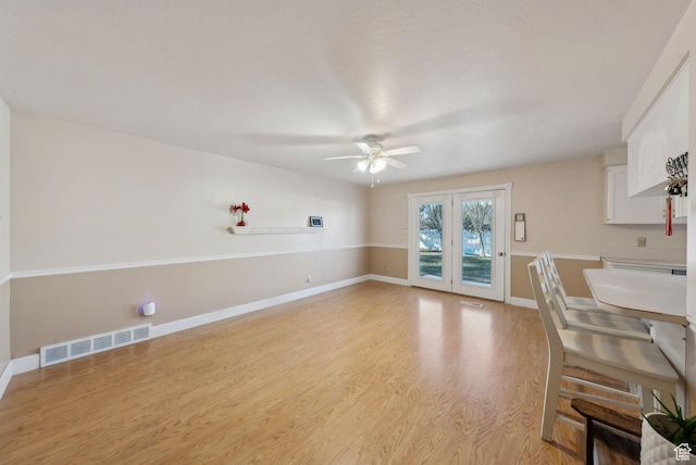 518 E Wendy Way S, Tremonton, UT 84337 - unfurnished dining area featuring a ceiling fan, baseboards, visible vents, and light wood-type flooring