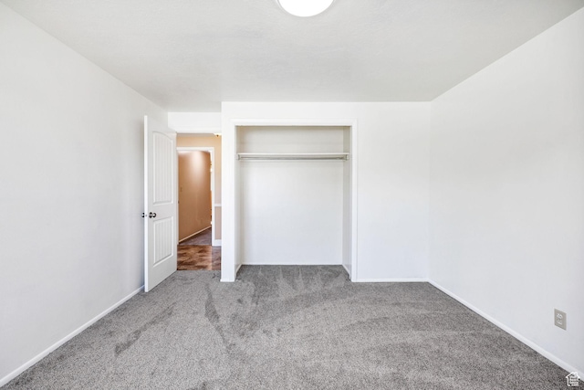 518 E Wendy Way S, Tremonton, UT 84337 - unfurnished bedroom with a closet, baseboards, and carpet flooring